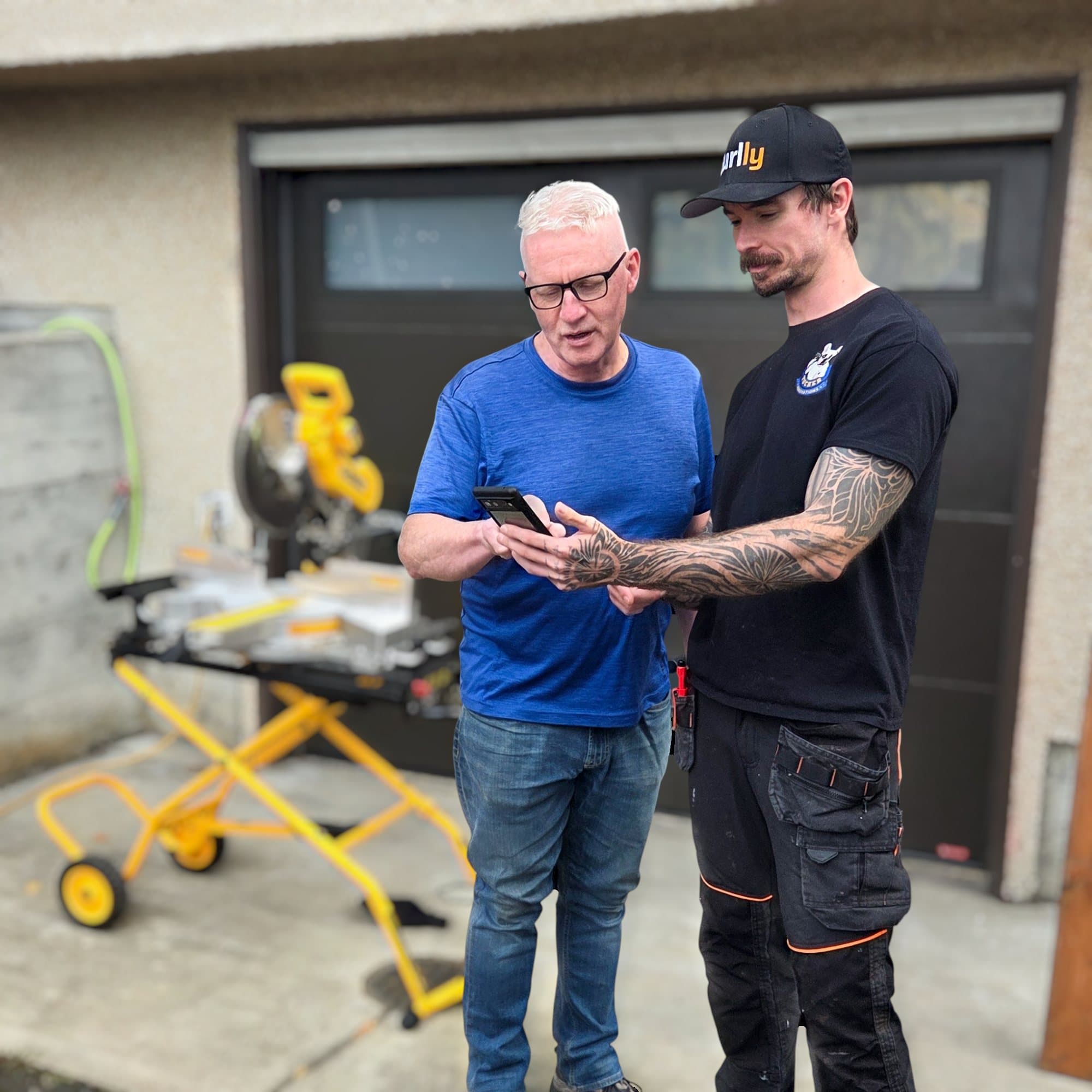 Caleb Wismer reviewing a change order with a client in Burlly